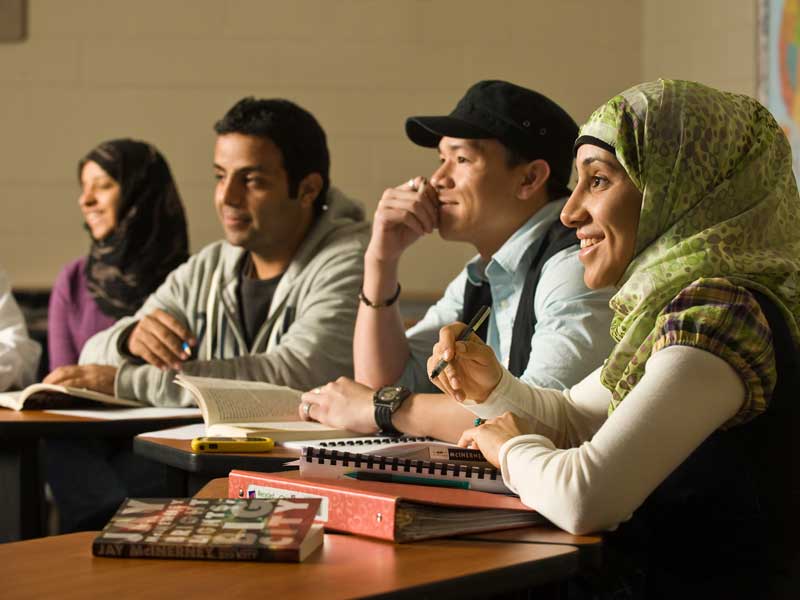 smiling v.c.u. students participating in a classroom discussion