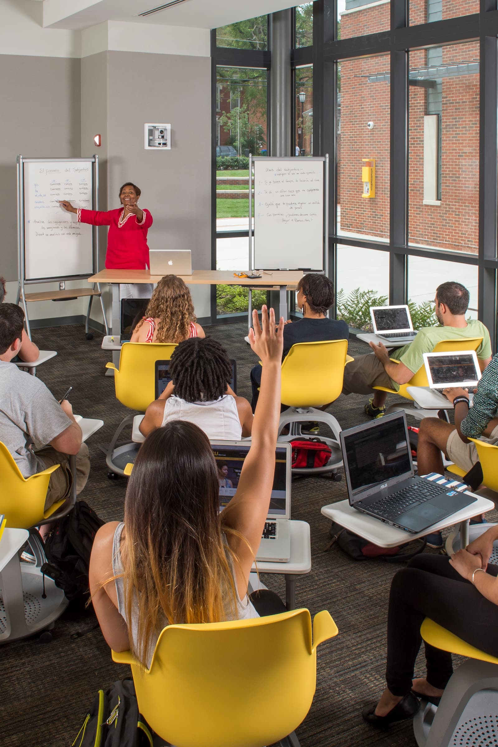 College of Humanities and Sciences students interact with their professor in a classroom in the newly built Academic Learning Commons.